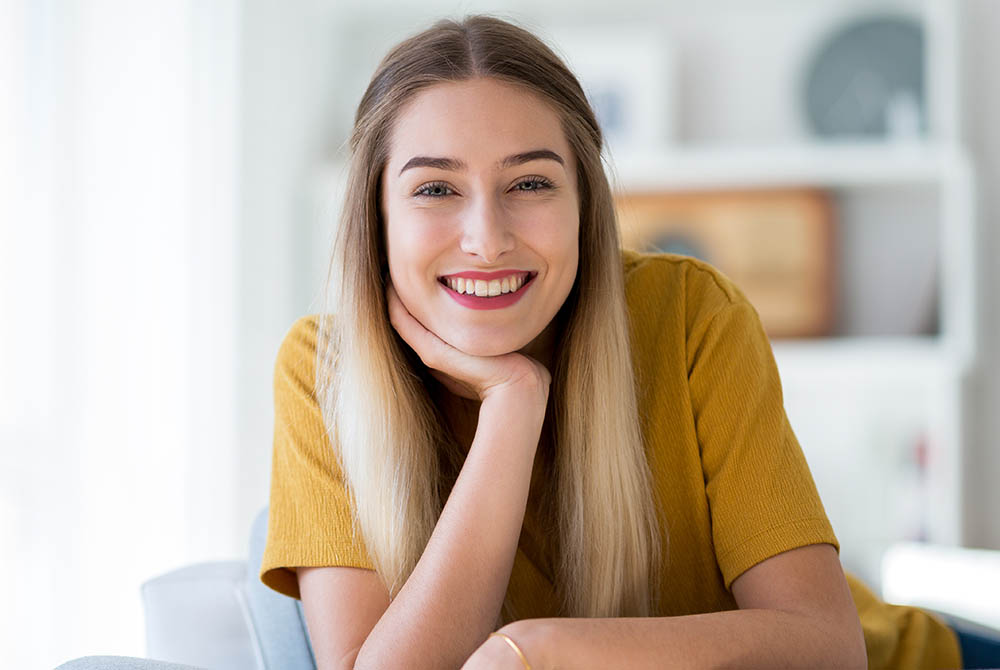 Portrait of a woman relaxing at home -1000x670